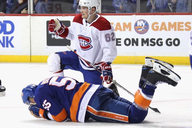 NEW YORK, NEW YORK - MARCH 03: Johnny Boychuk #55 of the New York Islanders is injured during the third period against the Montreal Canadiens at the Barclays Center on March 03, 2020 in the Brooklyn borough of New York City. (Photo by Bruce Bennett/Getty Images)