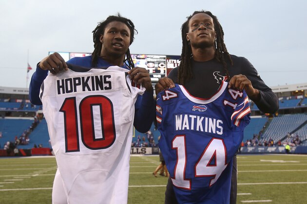 ORCHARD PARK, NY - DECEMBER 6: Sammy Watkins #14 of the Buffalo Bills exchanges jerseys with his friend DeAndre Hopkins #10 of the Houston Texans after their game during NFL game action at Ralph Wilson Stadium on December 6, 2015 in Orchard Park, New York. (Photo by Tom Szczerbowski/Getty Images)