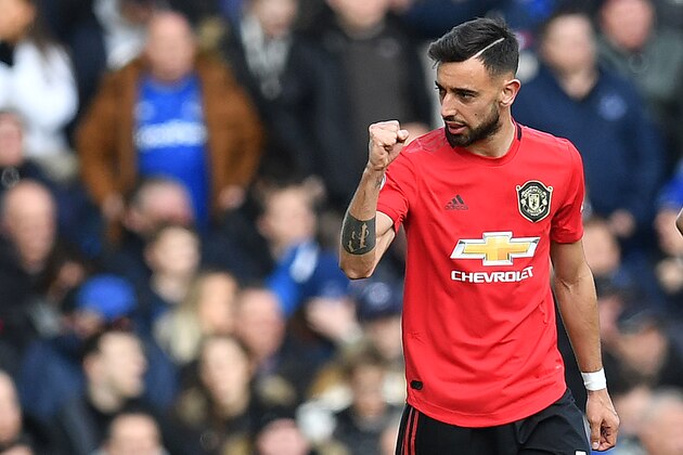 Manchester United's Portuguese midfielder Bruno Fernandes celebrates after scoring the equalising goal during the English Premier League football match between Everton and Manchester United at Goodison Park in Manchester United, north west England on March 1, 2020. (Photo by Paul ELLIS / AFP) / RESTRICTED TO EDITORIAL USE. No use with unauthorized audio, video, data, fixture lists, club/league logos or 'live' services. Online in-match use limited to 120 images. An additional 40 images may be used in extra time. No video emulation. Social media in-match use limited to 120 images. An additional 40 images may be used in extra time. No use in betting publications, games or single club/league/player publications. /  (Photo by PAUL ELLIS/AFP via Getty Images)