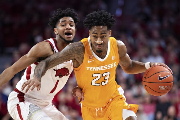 FAYETTEVILLE, AR - FEBRUARY 26:  Jordan Bowden #23 of the Tennessee Volunteers drives to the basket in the first half against Isaiah Joe #1 of the Arkansas Razorbacks at Bud Walton Arena on February 26, 2020 in Fayetteville, Arkansas.  (Photo by Wesley Hitt/Getty Images)