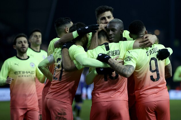 SHEFFIELD, ENGLAND - MARCH 04: Sergio Aguero of Manchester City celebrates with teammates after scoring his sides first goal during the FA Cup Fifth Round match between Sheffield Wednesday and Manchester City at Hillsborough on March 04, 2020 in Sheffield, England. (Photo by Clive Brunskill/Getty Images)