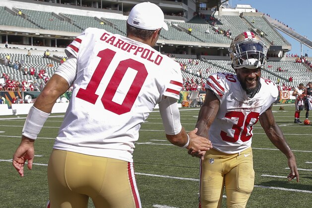 CINCINNATI, OH - SEPTEMBER 15: Jimmy Garoppolo #10 of the San Francisco 49ers congratulates Jeff Wilson Jr #30 of the San Francisco 49ers after the game against the Cincinnati Bengals at Paul Brown Stadium on September 15, 2019 in Cincinnati, Ohio. (Photo by Michael Hickey/Getty Images)