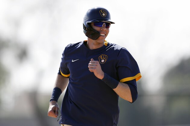 FILE - In this Feb. 19, 2020, file photo, Milwaukee Brewers' Christian Yelich reacts during a spring training baseball workout  in Phoenix. The Brewers are reportedly working on a new contract with star slugger Christian Yelich. It's an encouraging sign for Milwaukee after it lost a couple key performers during free agency. (AP Photo/Gregory Bull, File)