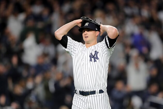 NEW YORK, NEW YORK - OCTOBER 04: Zack Britton #53 of the New York Yankees reacts to Aaron Judge #99 diving catch against the Minnesota Twins in the seventh inning during game one of the American League Division Series at Yankee Stadium on October 04, 2019 in New York City. (Photo by Elsa/Getty Images)