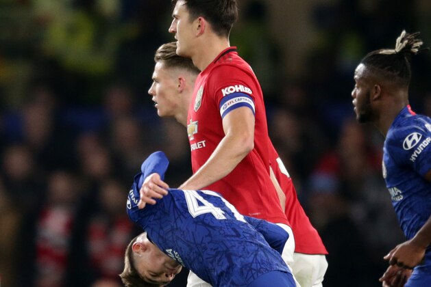 LONDON, ENGLAND - OCTOBER 30: Harry Maguire of Manchester United gets to grips with Billy Gilmour of Chelsea during the Carabao Cup Round of 16 match between Chelsea FC and Manchester United at Stamford Bridge on October 30, 2019 in London, England. (Photo by Robin Jones/Getty Images) LONDON, ENGLAND - OCTOBER 30: Harry Maguire of Manchester United gets to grips with Billy Gilmour of Chelsea during the Carabao Cup Round of 16 match between Chelsea FC and Manchester United at Stamford Bridge on October 30, 2019 in London, England. (Photo by Robin Jones/Getty Images)