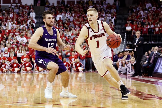 MADISON, WISCONSIN - MARCH 04: Brevin Pritzl #1 of the Wisconsin Badgers dribbles the ball while being guarded by Pat Spencer #12 of the Northwestern Wildcats in the second half at the Kohl Center on March 04, 2020 in Madison, Wisconsin. (Photo by Dylan Buell/Getty Images)