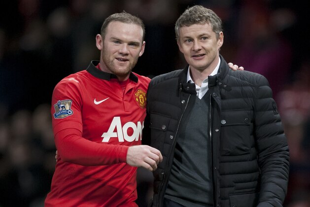 Manchester United's Wayne Rooney, left, walks from the pitch with Cardiff City's manager Ole Gunnar Solskjaer after their English Premier League soccer match at Old Trafford Stadium, Manchester, England, Tuesday Jan. 28, 2014. (AP Photo/Jon Super) Manchester United's Wayne Rooney, left, walks from the pitch with Cardiff City's manager Ole Gunnar Solskjaer after their English Premier League soccer match at Old Trafford Stadium, Manchester, England, Tuesday Jan. 28, 2014. (AP Photo/Jon Super)