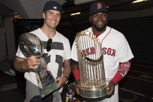 BOSTON, MA - APRIL 13: New England Patriots quarterback Tom Brady poses for a photograph with David Ortiz #34 of the Boston Red Sox in the batting cage after throwing out a ceremonial first pitch on Opening Day at Fenway Park on April 13, 2015 in Boston, Massachusetts. (Photo by Michael Ivins/Boston Red Sox/Getty Images)