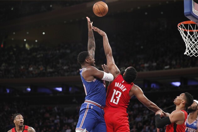 New York Knicks forward Julius Randle, left, tries to pass to a teammate as Houston Rockets guard James Harden (13) defends him during the second half of an NBA basketball game in New York, Monday, March 2020. The Knicks defeated the Rockets 125-123. (AP Photo/Kathy Willens)
