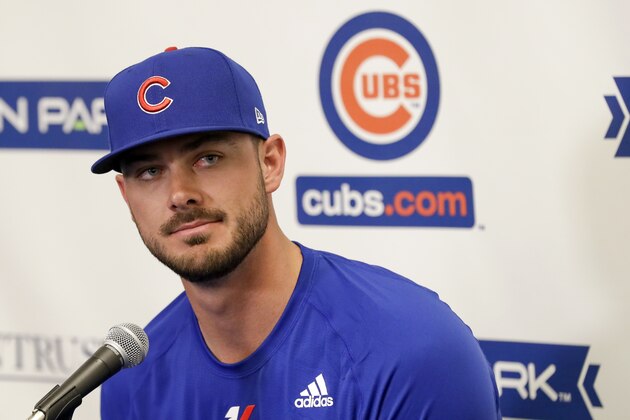 Chicago Cubs third baseman Kris Bryant speaks to reporters during spring training baseball Saturday, Feb. 15, 2020, in Mesa, Ariz. (AP Photo/Gregory Bull)