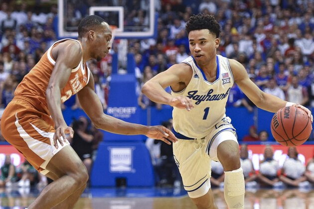 LAWRENCE, KANSAS - FEBUARY 3: Devon Dotson #1 of the Kansas Jayhawks drives against Matt Coleman III #2 of the Texas Longhorns at Allen Fieldhouse on February 3, 2020 in Lawrence, Kansas. (Photo by Ed Zurga/Getty Images)