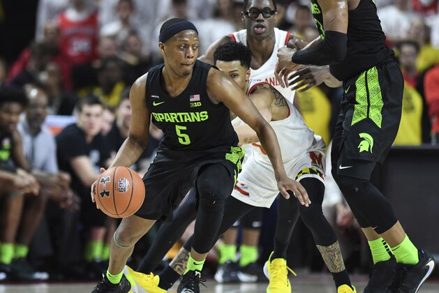 Michigan State guard Cassius Winston (5) handles the ball during the second half of an NCAA college basketball game against Maryland, Saturday, Feb. 29, 2020, in College Park, Md. (AP Photo/Terrance Williams)