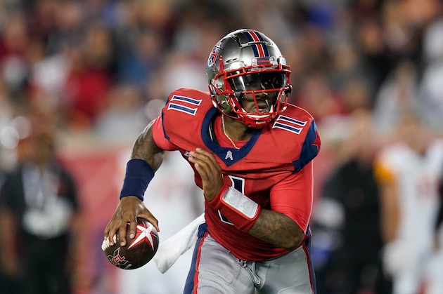 Houston Roughnecks quarterback P.J. Walker (11) looks to pass as he scrambles during an XFL football game, Saturday, Feb. 8, 2020, in Houston. (AP Photo/Matt Patterson)