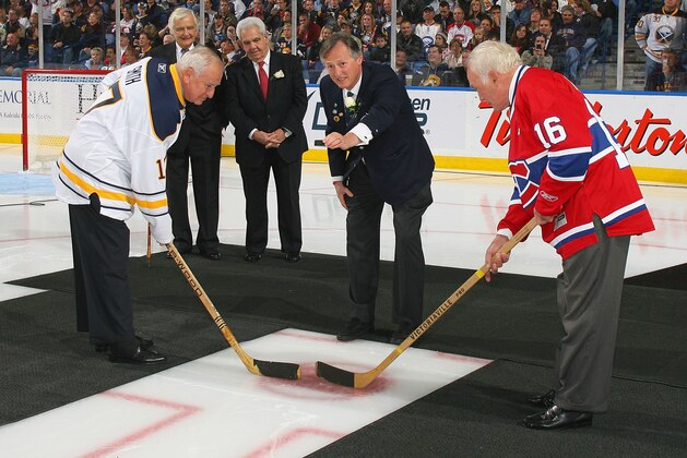 BUFFALO, NY - OCTOBER 15: Former Buffalo Sabres owner Seymour Knox III re-enacts the first puck drop at the first home game for the Buffalo Sabres 40 years ago on this date against  the Montreal Canadiens  against at HSBC Arena on October 15, 2010 in Buffalo, New York. Former Sabre player Floyd Smith (left) and  Henri Richard of the Montreal Canadiens take the faceoff.  (Photo by Rick Stewart/Getty Images)