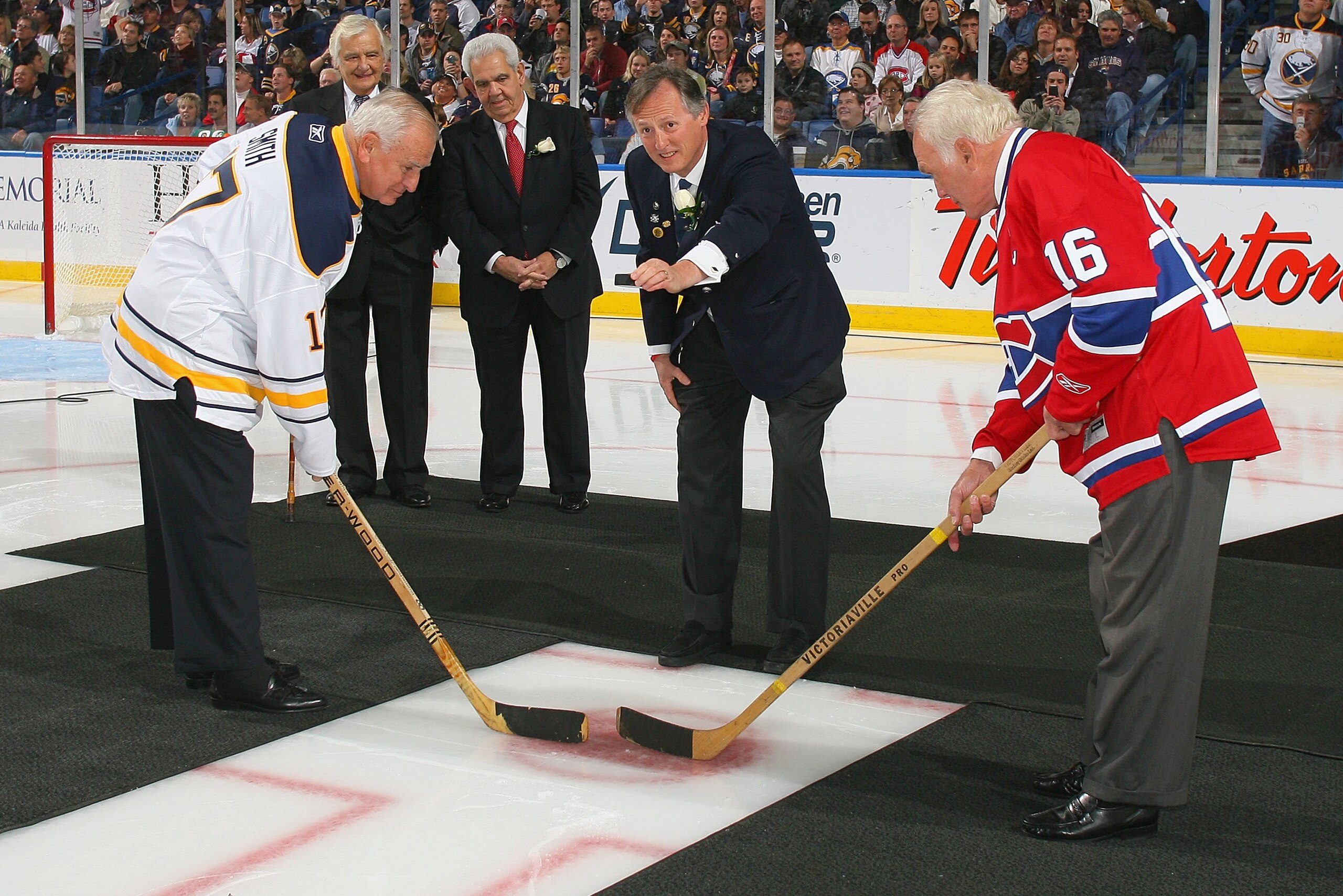 BUFFALO, NY - OCTOBER 15: Former Buffalo Sabres owner Seymour Knox III re-enacts the first puck drop at the first home game for the Buffalo Sabres 40 years ago on this date against  the Montreal Canadiens  against at HSBC Arena on October 15, 2010 in Buffalo, New York. Former Sabre player Floyd Smith (left) and  Henri Richard of the Montreal Canadiens take the faceoff.  (Photo by Rick Stewart/Getty Images)