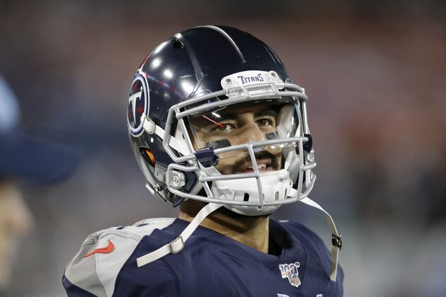 Tennessee Titans quarterback Marcus Mariota looks at the scoreboard in the second half of an NFL football game against the Jacksonville Jaguars Sunday, Nov. 24, 2019, in Nashville, Tenn. The Titans won 42-20. (AP Photo/James Kenney)