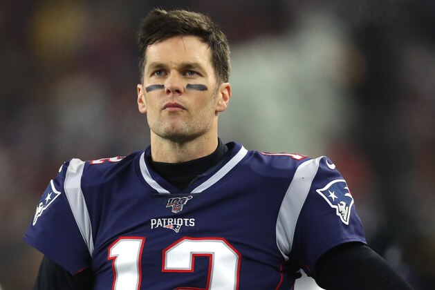 FOXBOROUGH, MASSACHUSETTS - JANUARY 04: Tom Brady #12 of the New England Patriots looks on from the sideline during the the AFC Wild Card Playoff game against the Tennessee Titans at Gillette Stadium on January 04, 2020 in Foxborough, Massachusetts. (Photo by Maddie Meyer/Getty Images)