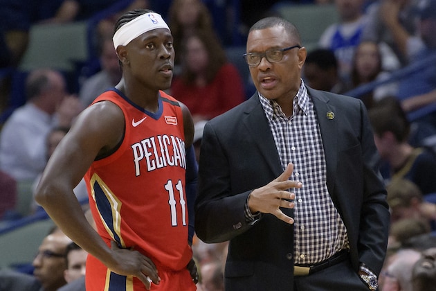 New Orleans Pelicans guard Jrue Holiday (11) talks with New Orleans Pelicans head coach Alvin Gentry against the Minnesota Timberwolves in the second half of an NBA basketball game in New Orleans, Tuesday, March 3, 2020. (AP Photo/Matthew Hinton)