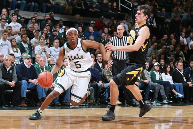 EAST LANSING, MI - DECEMBER 03: Cassius Winston #5 of the Michigan State Spartans drives past Luka Garza #55 of the Iowa Hawkeyes in the first half at Breslin Center on December 3, 2018 in East Lansing, Michigan. (Photo by Rey Del Rio/Getty Images) EAST LANSING, MI - DECEMBER 03: Cassius Winston #5 of the Michigan State Spartans drives past Luka Garza #55 of the Iowa Hawkeyes in the first half at Breslin Center on December 3, 2018 in East Lansing, Michigan. (Photo by Rey Del Rio/Getty Images)
