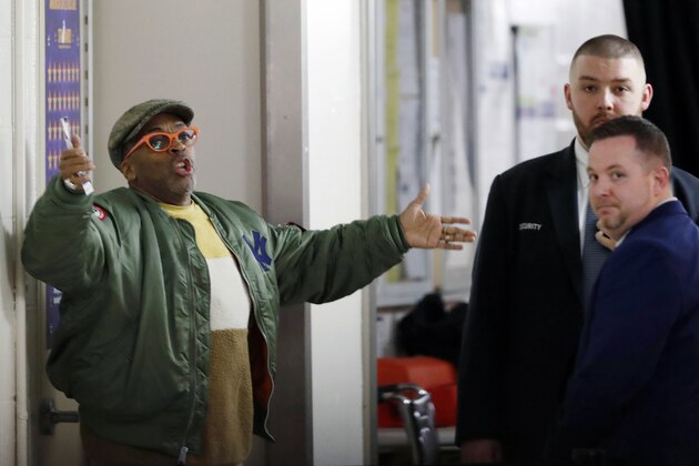 Director Spike Lee, left, gestures in a hallway on the event level at Madison Square Garden while arguing with security officers who didn't want to permit him to access his court side seat before the start of an NBA basketball game between the New York Knicks and the Houston Rockets in New York, Monday, March 2, 2020. Lee later spoke with Knicks owner James Dolan and security and was allowed to get to his seat to watch the game. (AP Photo/Kathy Willens)