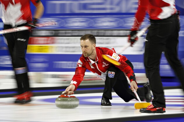Canada skip Brad Gushue, center, delivers a stone against Sweden during the World Men's Curling Championship, Friday, April 6, 2018, in Las Vegas. (AP Photo/John Locher)