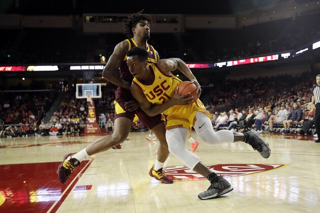 Southern California forward Onyeka Okongwu (21) is defended by Arizona State forward Romello White during the first half of an NCAA college basketball game Saturday, Feb. 29, 2020, in Los Angeles. (AP Photo/Marcio Jose Sanchez)