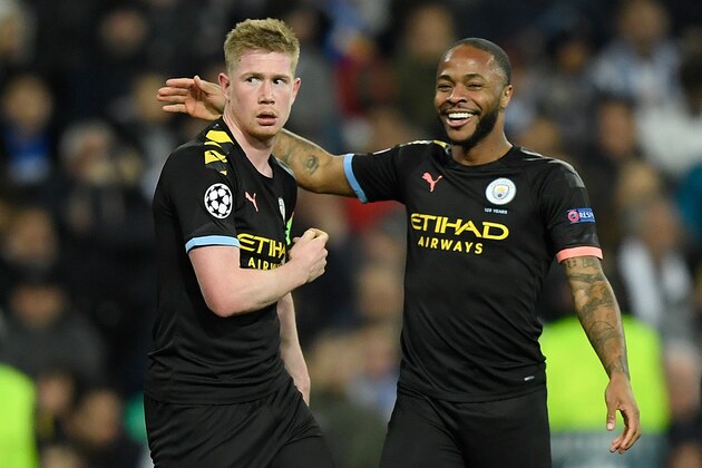 Manchester City's Belgian midfielder Kevin De Bruyne (L) celebrates with Manchester City's English midfielder Raheem Sterling after scoring a goal during the UEFA Champions League round of 16 first-leg football match between Real Madrid CF and Manchester City at the Santiago Bernabeu stadium in Madrid on February 26, 2020. (Photo by OSCAR DEL POZO / AFP) (Photo by OSCAR DEL POZO/AFP via Getty Images)