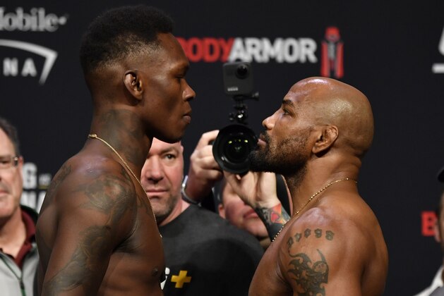LAS VEGAS, NEVADA - MARCH 06: (L-R) Opponents Israel Adesanya of Nigeria and Yoel Romero of Cuba face off during the UFC 248 weigh-in at T-Mobile Arena on March 06, 2020 in Las Vegas, Nevada. (Photo by Jeff Bottari/Zuffa LLC)