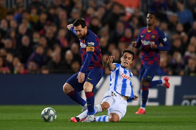 BARCELONA, SPAIN - MARCH 07: Lionel Messi of FC Barcelona is tackled by Ander Guevara of Real Sociedad during the La Liga match between FC Barcelona and Real Sociedad at Camp Nou on March 07, 2020 in Barcelona, Spain. (Photo by Alex Caparros/Getty Images) BARCELONA, SPAIN - MARCH 07: Lionel Messi of FC Barcelona is tackled by Ander Guevara of Real Sociedad during the La Liga match between FC Barcelona and Real Sociedad at Camp Nou on March 07, 2020 in Barcelona, Spain. (Photo by Alex Caparros/Getty Images)