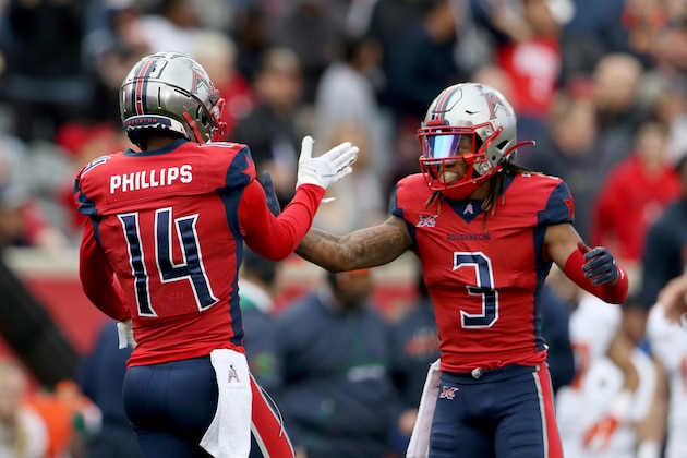 HOUSTON, TX - MARCH 7: Cam Phillips #14 of the Houston Roughnecks with Sam Mobley #3 during the XFL game against the Seattle Dragons at TDECU Stadium on March 7, 2020 in Houston, Texas. (Photo by Michael Starghill/XFL via Getty Images)