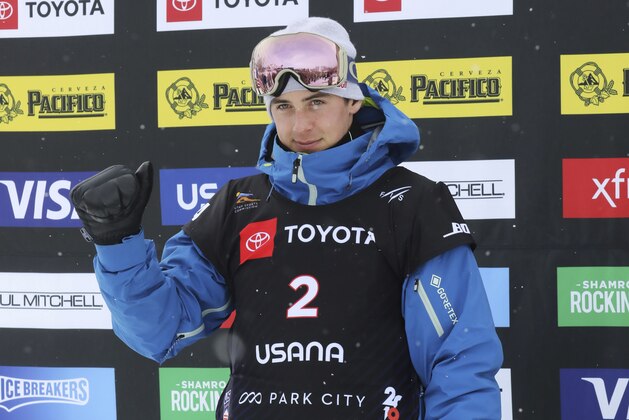 Second-place finisher Mark McMorris, of Canada, celebrates on the podium following the men's slopestyle snowboard world championship Sunday, Feb. 10, 2019, in Park City, Utah. (AP Photo/Rick Bowmer)
