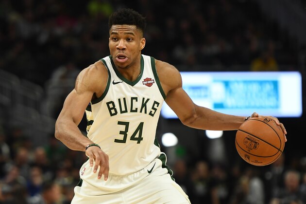 MILWAUKEE, WISCONSIN - DECEMBER 14:  Giannis Antetokounmpo #34 of the Milwaukee Bucks handles the ball during a game against the Cleveland Cavaliers at Fiserv Forum on December 14, 2019 in Milwaukee, Wisconsin. NOTE TO USER: User expressly acknowledges and agrees that, by downloading and or using this photograph, User is consenting to the terms and conditions of the Getty Images License Agreement.  (Photo by Stacy Revere/Getty Images)