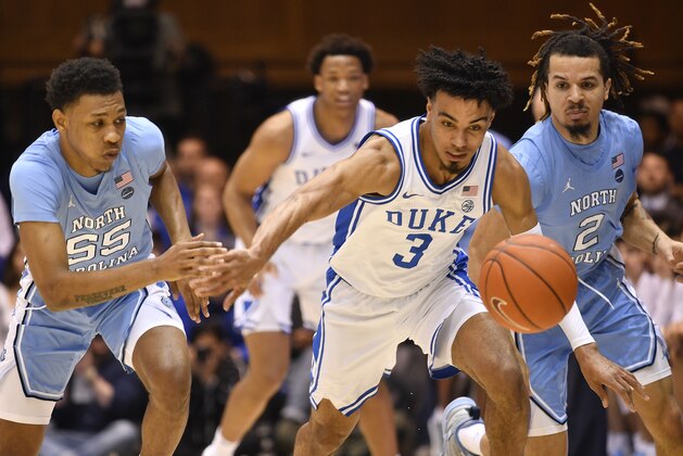 DURHAM, NORTH CAROLINA - MARCH 07: Tre Jones #3 of the Duke Blue Devils battles Christian Keeling #55 and Cole Anthony #2 of the North Carolina Tar Heels for a loose ball during the first half of their game at Cameron Indoor Stadium on March 07, 2020 in Durham, North Carolina. (Photo by Grant Halverson/Getty Images)