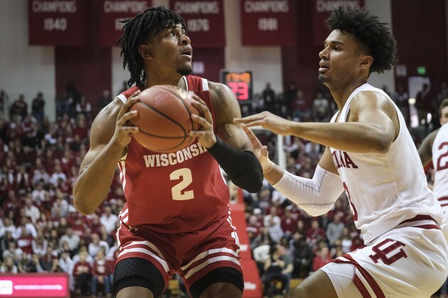 Wisconsin forward Aleem Ford, left, looks to shoot over Indiana forward Justin Smith in the second half of an NCAA college basketball game in Bloomington, Ind., Saturday, March 7, 2020. Wisconsin won 60-56. (AP Photo/AJ Mast)