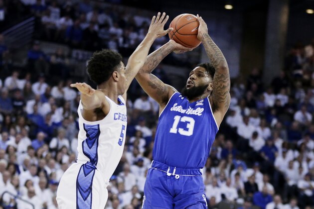 Seton Hall's Myles Powell (13) shoots against Creighton's Ty-Shon Alexander (5) during the first half of an NCAA college basketball game in Omaha, Neb., Saturday, March 7, 2020. (AP Photo/Nati Harnik)