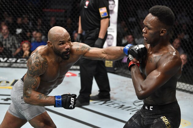 LAS VEGAS, NEVADA - MARCH 07: (L-R) Yoel Romero of Cuba punches Israel Adesanya of Nigeria in their UFC middleweight championship fight during the UFC 248 event at T-Mobile Arena on March 07, 2020 in Las Vegas, Nevada. (Photo by Jeff Bottari/Zuffa LLC)