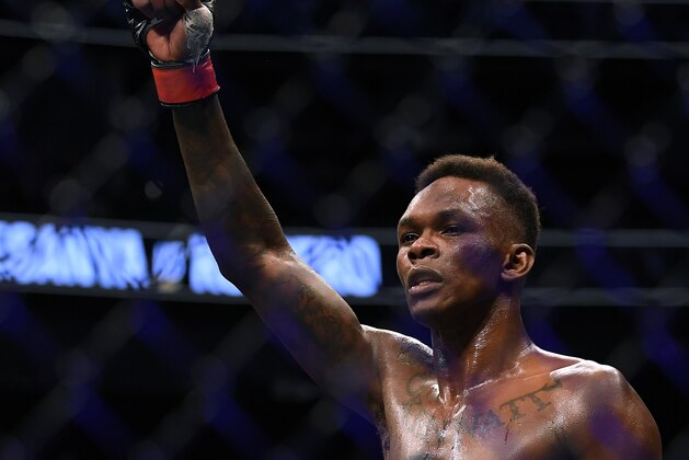 LAS VEGAS, NEVADA - MARCH 07:  Israel Adesanya celebrates a decision win over Yoel Romero during a middleweight title bout at T-Mobile Arena on March 07, 2020 in Las Vegas, Nevada. (Photo by Harry How/Getty Images)