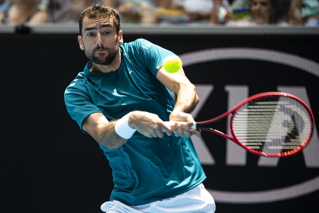 MELBOURNE, AUSTRALIA - JANUARY 26: Marin Cilic of Croatia plays a backhand in his fourth round match against Milos Raonic of Canada on day seven of the 2020 Australian Open at Melbourne Park on January 26, 2020 in Melbourne, Australia. (Photo by TPN/Getty Images)