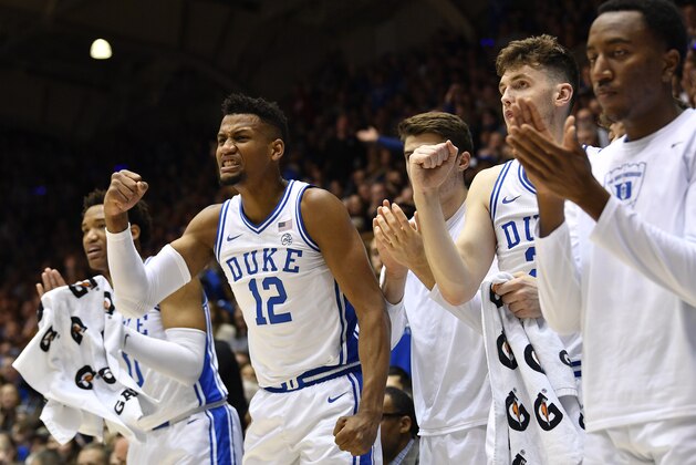 DURHAM, NORTH CAROLINA - MARCH 07: Javin DeLaurier #12 andf the Duke Blue Devils bench react during the first half of their game against the North Carolina Tar Heels at Cameron Indoor Stadium on March 07, 2020 in Durham, North Carolina. (Photo by Grant Halverson/Getty Images)
