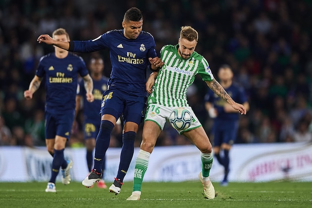 SEVILLE, SPAIN - MARCH 08: Loren of Real Betis Balompie competes for the ball with Casemiro of Real Madrid CF during the Liga match between Real Betis Balompie and Real Madrid CF at Estadio Benito Villamarin on March 08, 2020 in Seville, Spain.  (Photo by Silvestre Szpylma/Quality Sport Images/Getty Images)