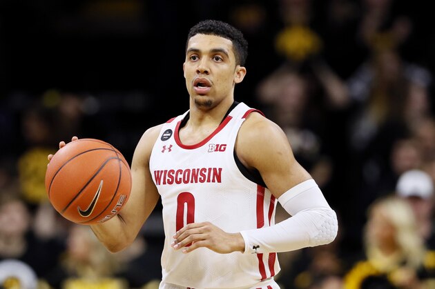 Wisconsin guard D'Mitrik Trice drives up court during the first half of an NCAA college basketball game against Iowa, Monday, Jan. 27, 2020, in Iowa City, Iowa. (AP Photo/Charlie Neibergall)