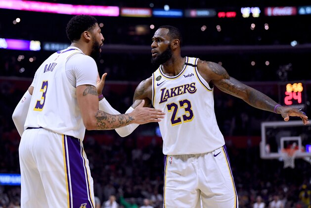 LOS ANGELES, CALIFORNIA - MARCH 08:  LeBron James #23 and Anthony Davis #3 of the Los Angeles Lakers celebrate a basket during a 112-103 win over the LA Clippers at Staples Center on March 08, 2020 in Los Angeles, California.   NOTE TO USER: User expressly acknowledges and agrees that, by downloading and or using this photograph, User is consenting to the terms and conditions of the Getty Images License Agreement.  (Photo by Harry How/Getty Images)