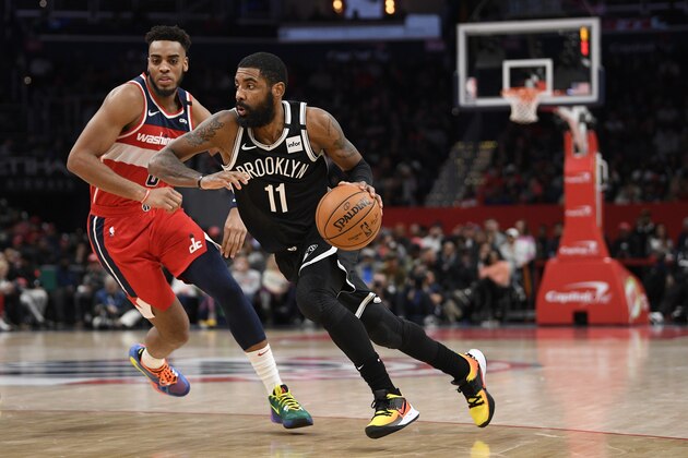 Brooklyn Nets guard Kyrie Irving (11) dribbles the ball against Washington Wizards forward Troy Brown Jr. (6) during the second half of an NBA basketball game, Saturday, Feb. 1, 2020, in Washington. The Wizards won 113-107. (AP Photo/Nick Wass) Brooklyn Nets guard Kyrie Irving (11) dribbles the ball against Washington Wizards forward Troy Brown Jr. (6) during the second half of an NBA basketball game, Saturday, Feb. 1, 2020, in Washington. The Wizards won 113-107. (AP Photo/Nick Wass)