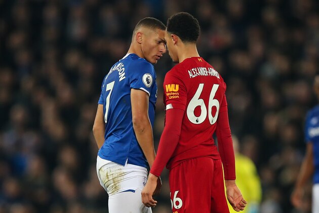 LIVERPOOL, ENGLAND - DECEMBER 04: Richarlison of Everton and Trent Alexander-Arnold of Liverpool square up to each other during the Premier League match between Liverpool FC and Everton FC at Anfield on December 4, 2019 in Liverpool, United Kingdom. (Photo by Robbie Jay Barratt - AMA/Getty Images)