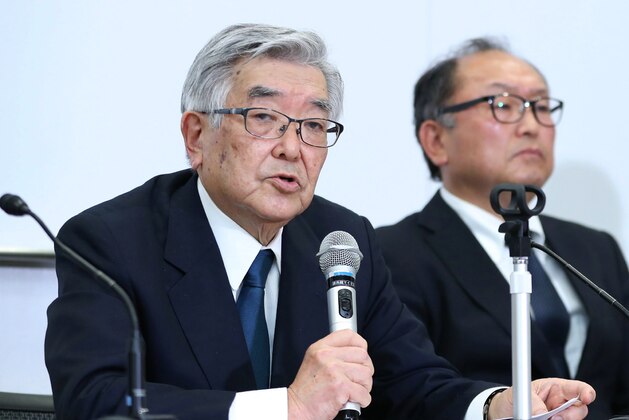 Atsushi Saito (L), the commissioner of Nippon Professional Baseball, speaks to reporters during a press conference in Tokyo on March 9, 2020. - Japan's professional baseball season, originally set to open on March 20, will be postponed for the first time since the 2011 earthquake due to concerns over the spread of the new coronavirus, the league's boss said March 9. (Photo by STR / JIJI PRESS / AFP) / Japan OUT (Photo by STR/JIJI PRESS/AFP via Getty Images)