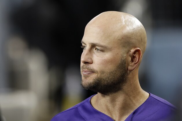 Colorado Rockies' Matt Holliday looks over in the dugout before a baseball game against the Los Angeles Dodgers in Los Angeles, Monday, Sept. 17, 2018. (AP Photo/Alex Gallardo)