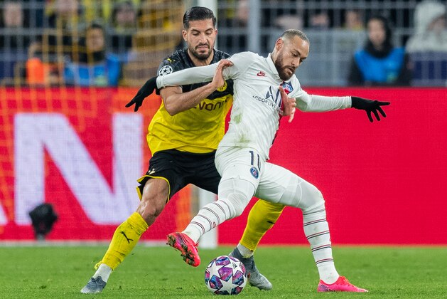 DORTMUND, GERMANY - FEBRUARY 18: Neymar of Paris Saint-Germain is challenged by Emre Can of Borussia Dortmund during the UEFA Champions League round of 16 first leg match between Borussia Dortmund and Paris Saint-Germain at Signal Iduna Park on February 18, 2020 in Dortmund, Germany. (Photo by Boris Streubel/Getty Images)