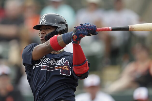 Atlanta Braves center fielder Ronald Acuna Jr. (13) bats during a spring training baseball game against the Baltimore Orioles Wednesday, Feb. 26, 2020, in Sarasota, Fla. (AP Photo/John Bazemore)