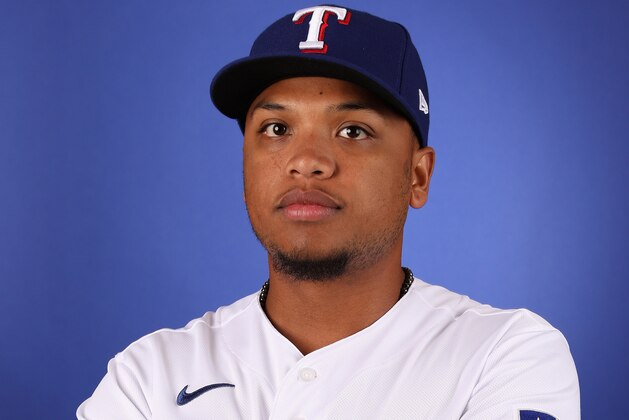 SURPRISE, ARIZONA - FEBRUARY 19:  Willie Calhoun #5 of the Texas Rangers poses for a portrait during MLB media day on February 19, 2020 in Surprise, Arizona. (Photo by Christian Petersen/Getty Images)