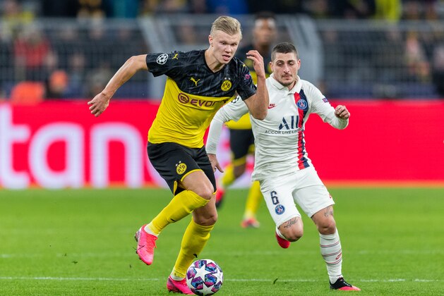 DORTMUND, GERMANY - FEBRUARY 18: Erling Braut Haaland of Borussia Dortmund is challenged by Marco Verratti of Paris Saint-Germain during the UEFA Champions League round of 16 first leg match between Borussia Dortmund and Paris Saint-Germain at Signal Iduna Park on February 18, 2020 in Dortmund, Germany. (Photo by Boris Streubel/Getty Images)